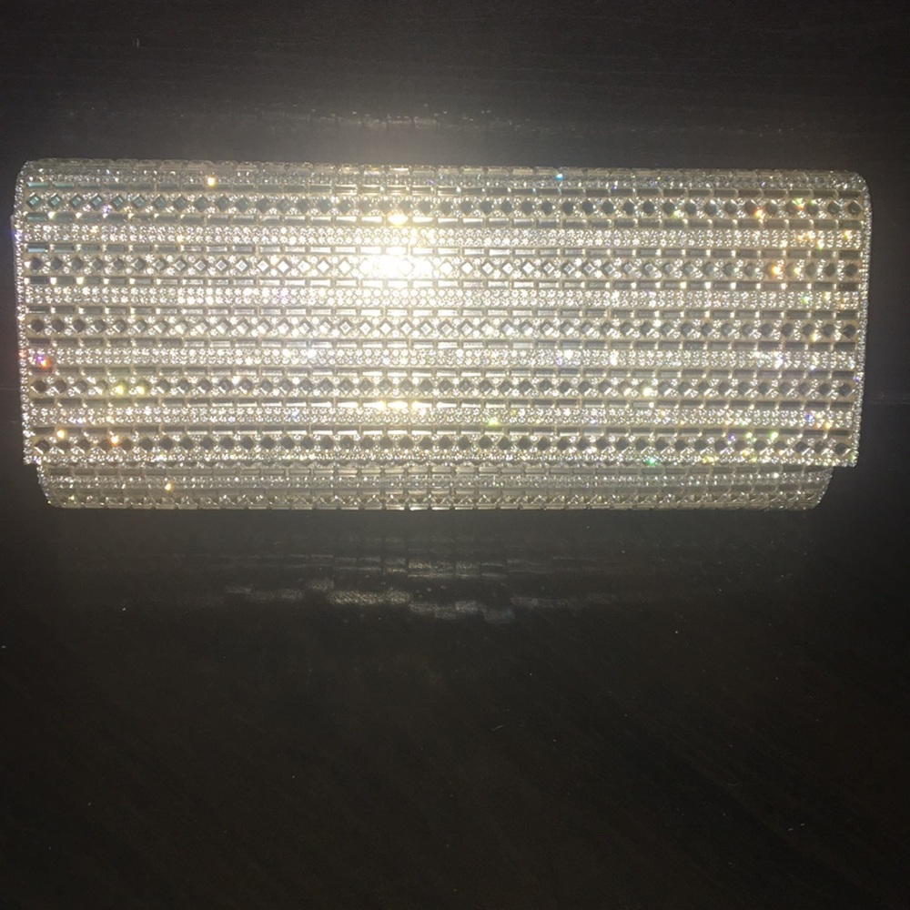 A gold clutch with a usable strap inside.